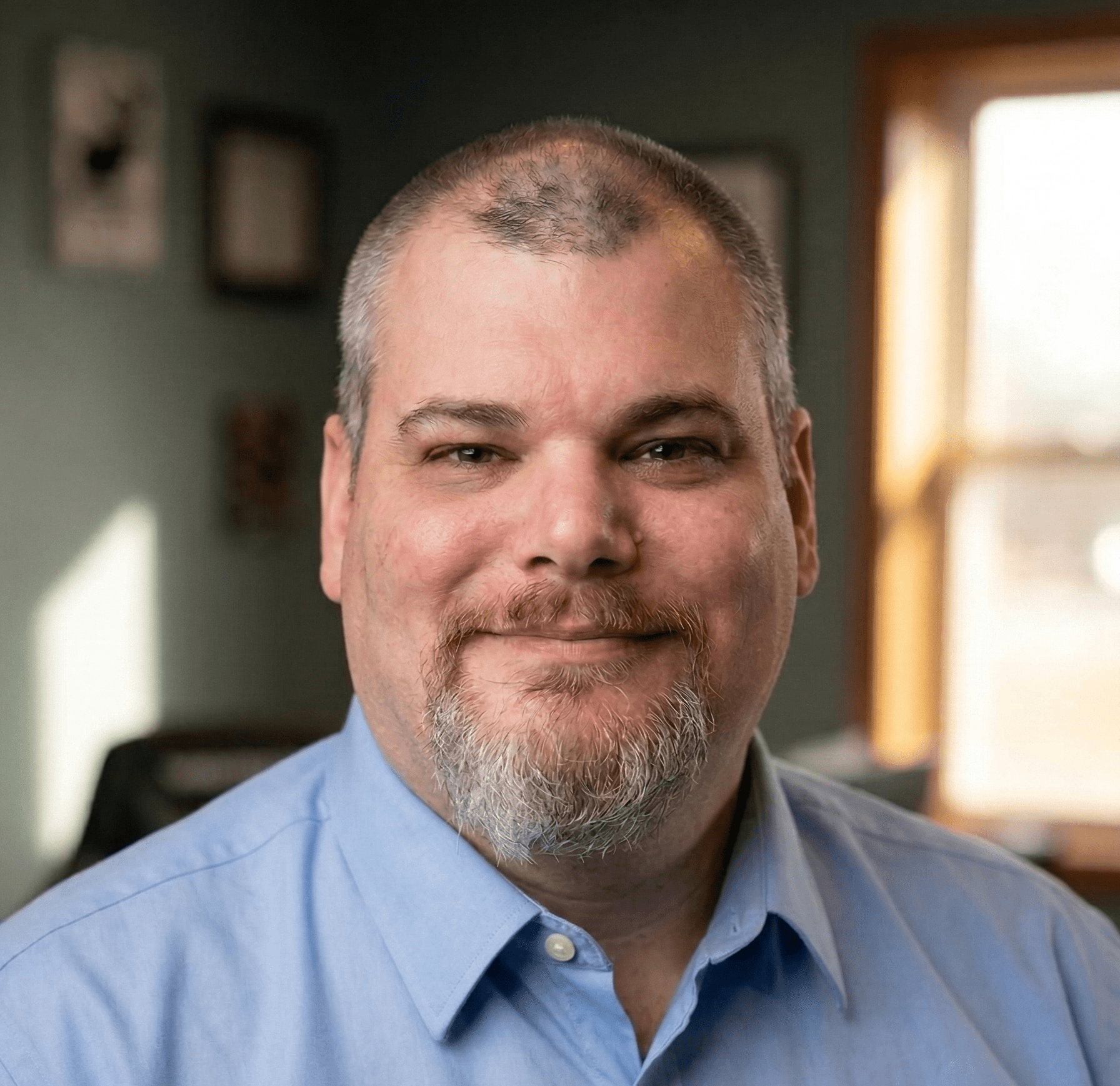 man inmid 40s with a blue button up short