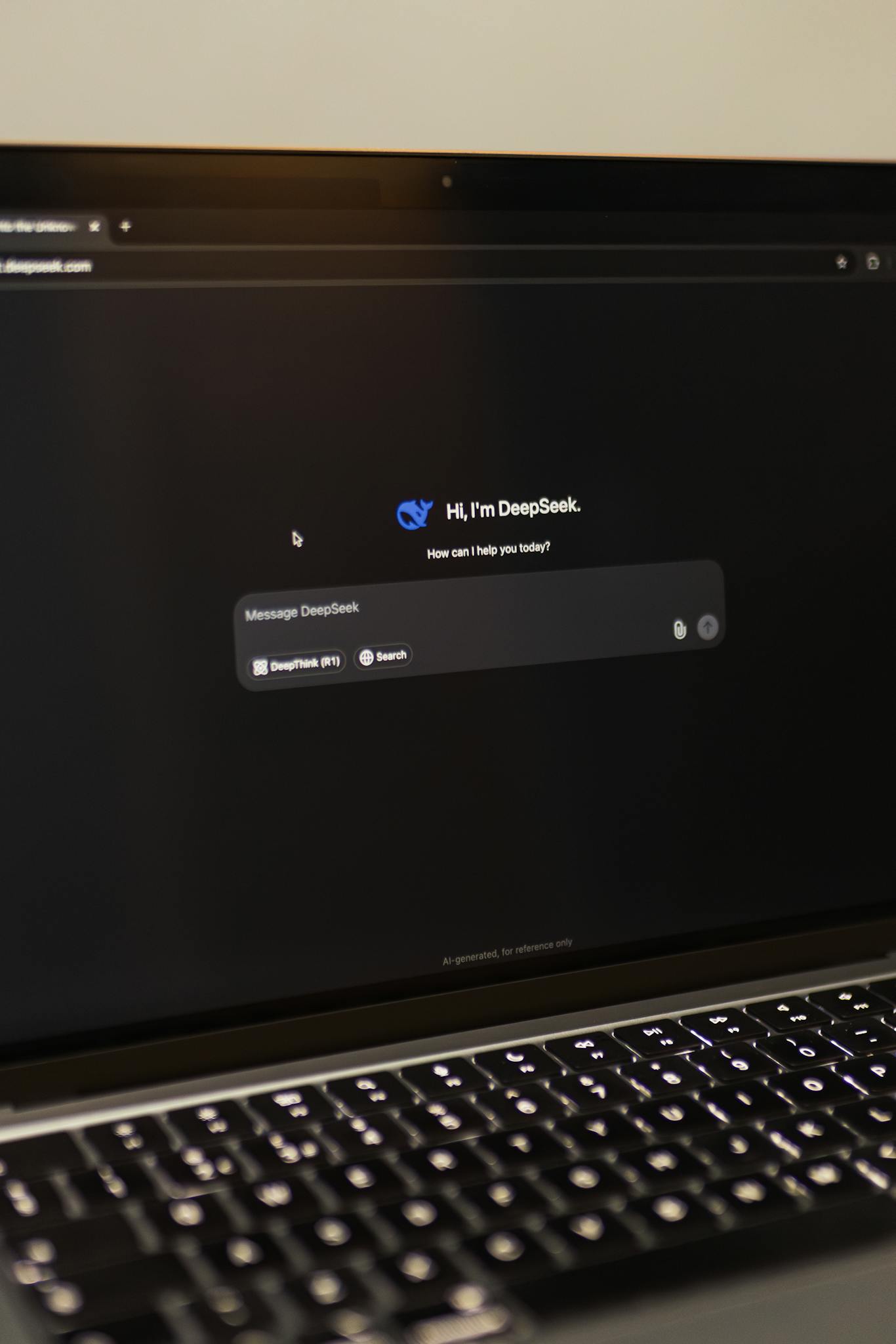 Image of a laptop showing an interactive AI interface with DeepSeek application.